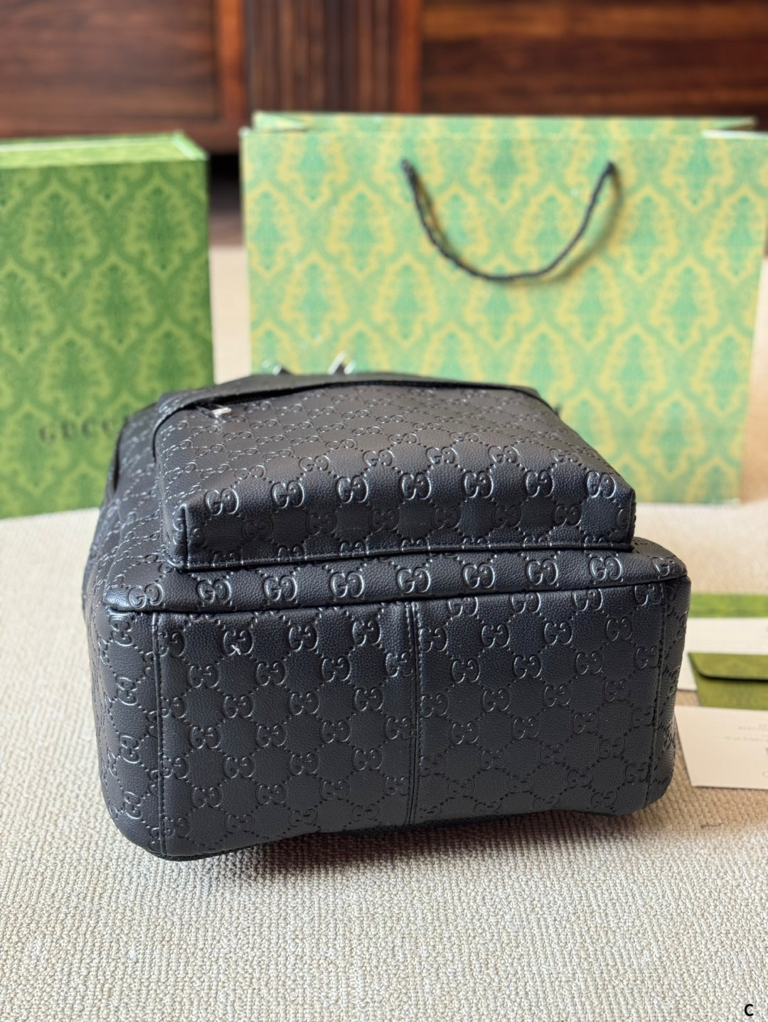 GUI Embossed leather backpack 1825052304
