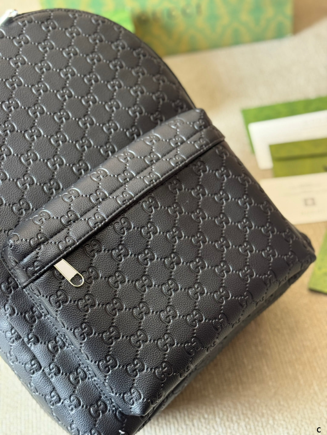 GUI Embossed leather backpack 1825052304