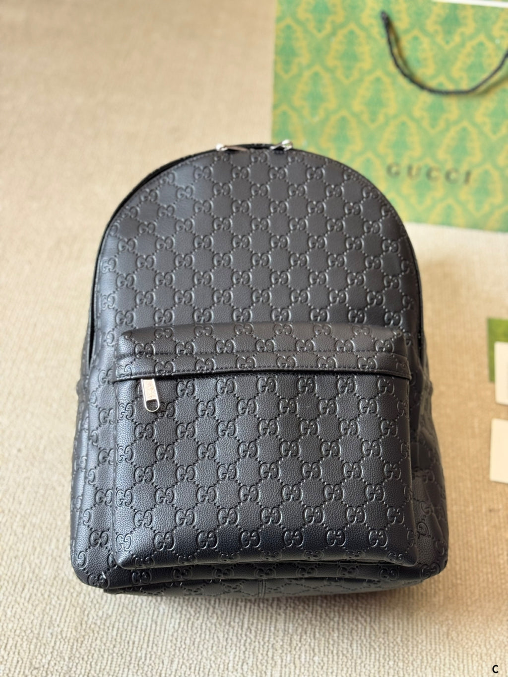GUI Embossed leather backpack 1825052304