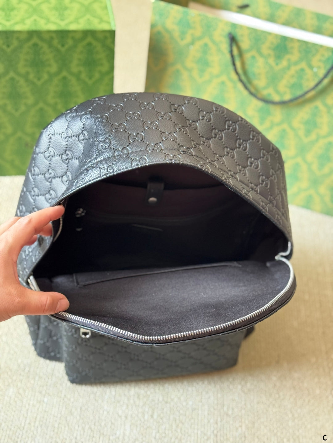 GUI Embossed leather backpack 1825052304