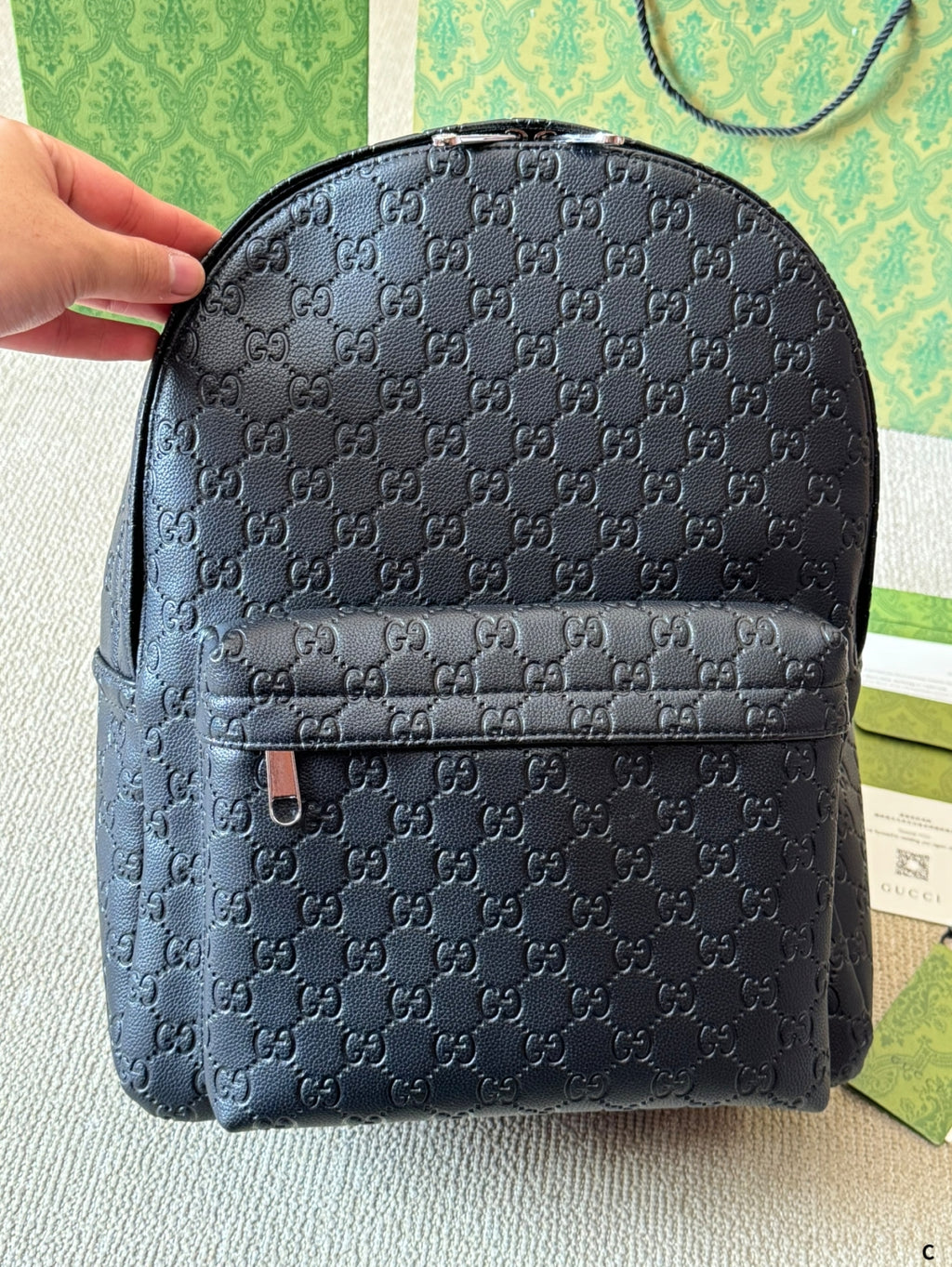 GUI Embossed leather backpack 1825052304